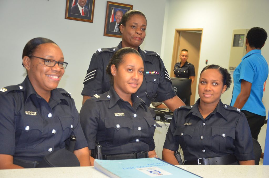 Officers Of The Trinidad And Tobago Police Service Smile For A Photo.